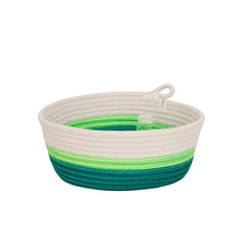 Rope basket with green and blue stripes on a white background